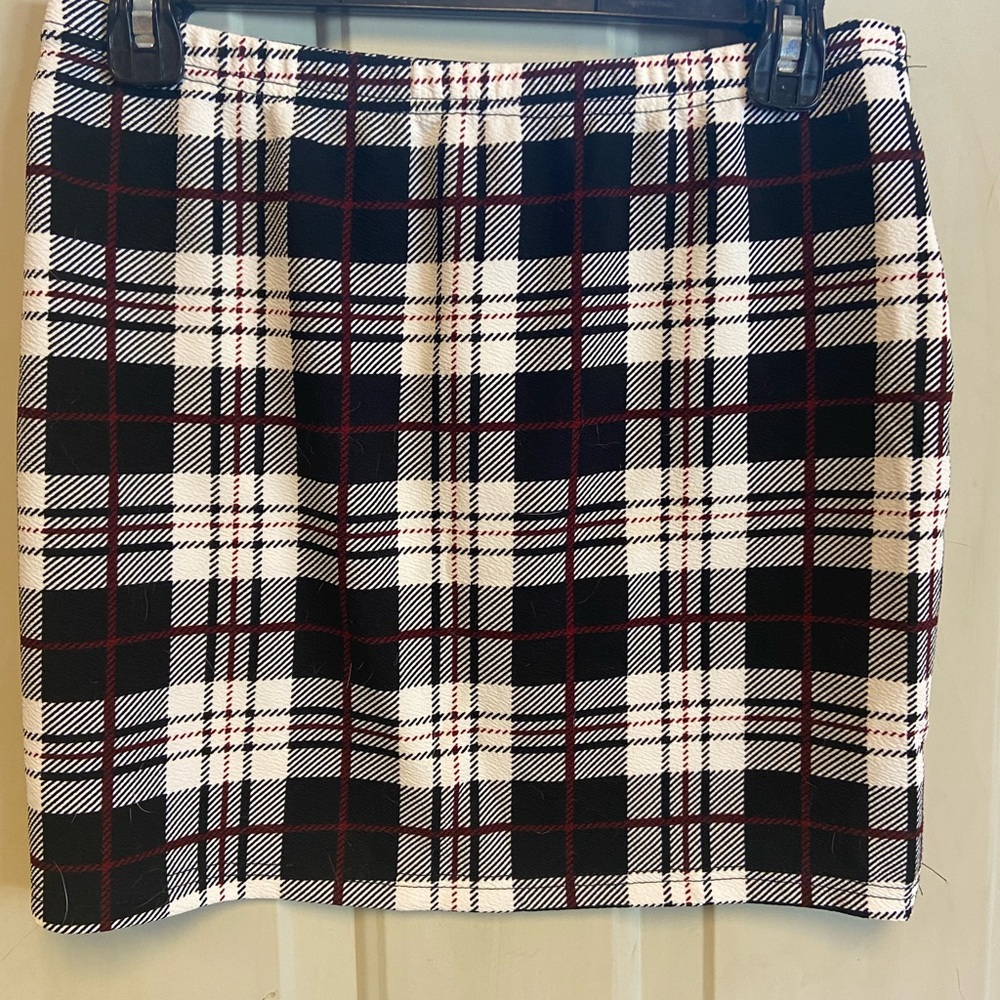 Woman’s mini skirt. Black,white and Burgundy plaid.